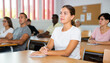 © JackF - Portrait of attentive positive young female student studying on training session in lecture class