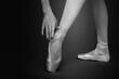 Ballerina in pointe shoes, closeup. Black and white effect