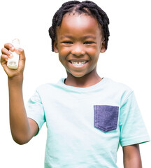 Portrait of happy boy holding asthma inhaler