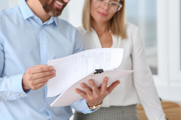 Canvas Print - Businesspeople working with documents in office, closeup