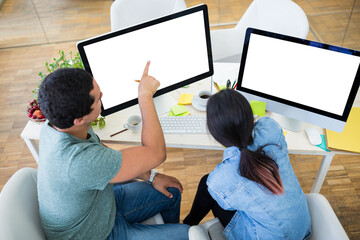 Graphic designers working at desk