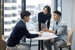 © Blue Jean Images - Confident Chinese designers having a meeting