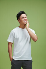 Wall Mural - Asian man is upset about a toothache