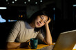 © Wavebreak Media - Asian businesswoman sitting at desk, using laptop and working late at office
