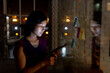 © Wavebreak Media - Asian businesswoman using tablet and making notes on glass wall, working late at office