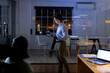 © Wavebreak Media - Diverse business people using tablet, making notes on glass wall, brainstorming late at office