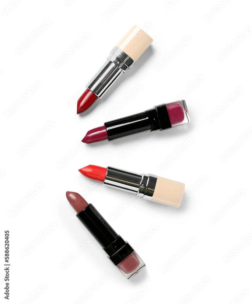 Set of different lipsticks on white background