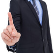 Mid section of businessman pointing something up