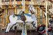 detail view of a classic and historic merry-go-round carousel with a horse and race car