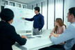 © offsuperphoto - businesspeople team meeting or seminar. and presentation about work project on whiteboard (vintage tone)