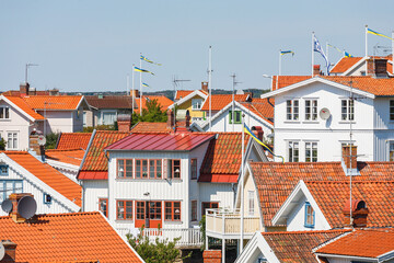 Canvas Print - Residential area with white wooden houses in Sweden