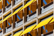 Copenhagen, Denmark A office building with yellow awnings over the windows to protect from the sun.