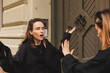 © zvkate - Quarrel two friends. Two women screaming at each other. Two young women argue near door outdoor on the street. Family problem. Angry female show emotion. Depression people. Stress family photo.