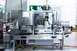 © Mihail - Alcohol beverage production on the factory. aluminium cans on conveyor belt of drink filling machine.