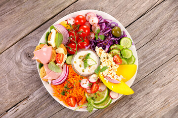 Sticker - mixed vegetable salad and bowl of sauce