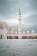 Tall mosque with a dark clouds