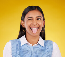 Sticker - Funny, emoji and woman with tongue out, happy and cheerful against a studio background. Female, stress relief and girl with facial expression, humor and goofy action for joy, crazy and happiness