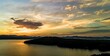 Wide angle of Lake Jocassee surrounded by hills and forests at sunrise in South Carolina, USA