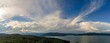 Panoramic shot of Lake Jocassee surrounded by hills and forests in South Carolina, USA