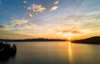 Drone view of the early morning sunrise on Lake Jocassee surrounded by hills in South Carolina, USA