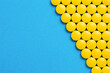 Frame of yellow pills