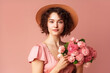 © ksu_ok - Portrait of beautiful young woman in summer dress and straw hat holding carnations bouquet  over pink background, generative AI tools