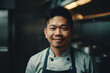Portrait of a male asian chef stood in a professional kitchen. Generative ai