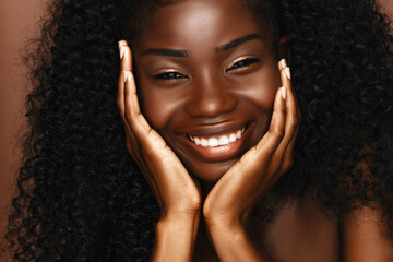 Wall Mural - African American model beauty portrait. Brunette curly haired young woman with dark skin and a perfect smile