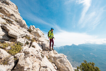 climber goes along the rocky ridge. girl climbing in the mountains. turkey. the concept of adventure