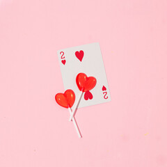 Sticker - Valentines day creative layout with heart lollipops and playing card on pastel pink background. 80s or 90s retro fashion aesthetic love concept. Minimal romantic cosmetic idea.