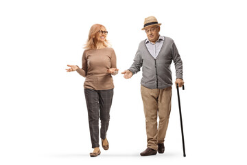 Poster - Elderly man with a cane and woman walking towards camera and talking