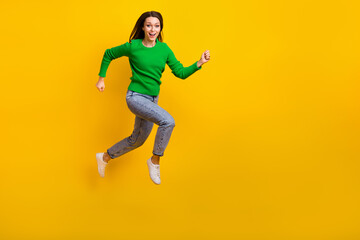 Sticker - Full length photo of overjoyed cheerful person jumping rush empty space isolated on yellow color background