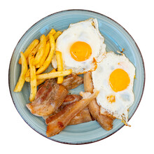 Close Up Of Grilled Bacon With Fried Potato And Egg Served On Blue Plate. Isolated Over White Background