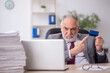 © Elnur - Old male employee and too much work in the office