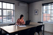 © Wavebreak Media - Asian businesswoman sitting at desk and using laptop, working late at office