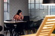 © Wavebreak Media - Asian businesswoman sitting at desk and using laptop, working late at office
