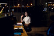 © Wavebreak Media - Happy asian businesswoman sitting at desk, using computer for video call, working late at office