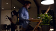 © Wavebreak Media - Happy diverse business people using laptop and tablet, working late at office