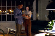 © Wavebreak Media - Diverse business people using tablet together and discussing, working late at office
