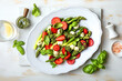 Green asparagus, strawberry, mozzarella cheese and pesto sauce salad