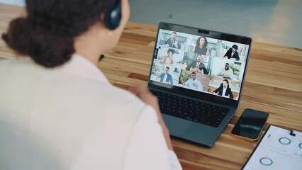 Sticker - View over businesslady shoulder, seated at workplace in modern office, talking with diverse multiracial coworkers, consulting them by video conference negotiations, discuss work issues, ideas,strategy