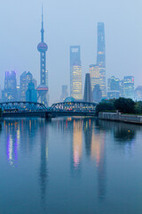 Wall Mural - Skyscrapers of Pudong behind historical Waibaidu bridge in Shanghai, China