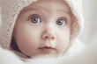 © lanych - Cute sweet little baby closeup in knitted bonnet. Generative AI