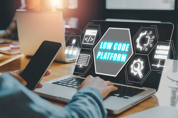 Low Code software development platform technology concept, Woman hand typing on keyboard computer with Low Code software development platform icon on virtual screen.
