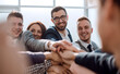 © ASDF - close up. group of young business people putting their palms together