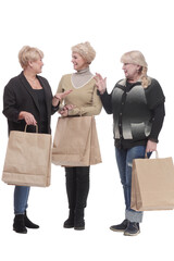 Wall Mural - in full growth. three happy women with shopping bags.