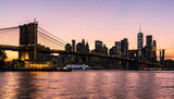 Fototapeta  - New York City Brooklyn Bridge and Lower Manhattan at Sunset