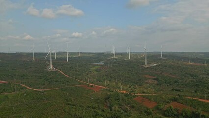 Wall Mural - Aerial footage of wind turbines generating clean renewable energy at wind farm.