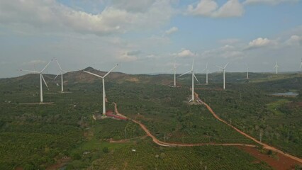 Wall Mural - Aerial footage of wind turbines generating clean renewable energy at wind farm.