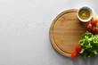 Food photography. Fresh cherry tomatoes, mustard and lettuce on white wooden table, top view with space for text